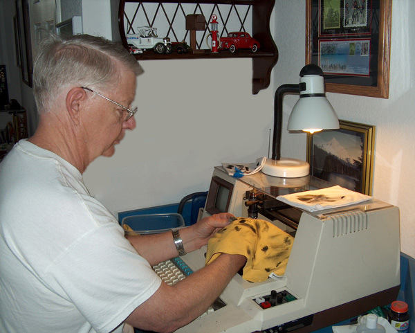 Nathan working at an engraver